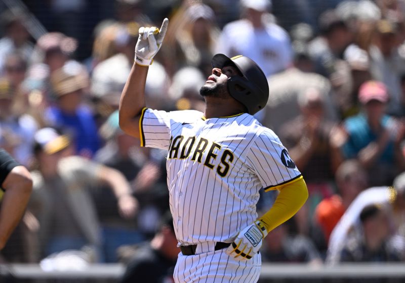 Apr 30, 2025; San Diego, California, USA; San Diego Padres catcher Elias Diaz (17) points skyward after hitting a solo home run during the third inning against the San Francisco Giants at Petco Park. Adames was out on the play. Mandatory Credit: Denis Poroy-Imagn Images