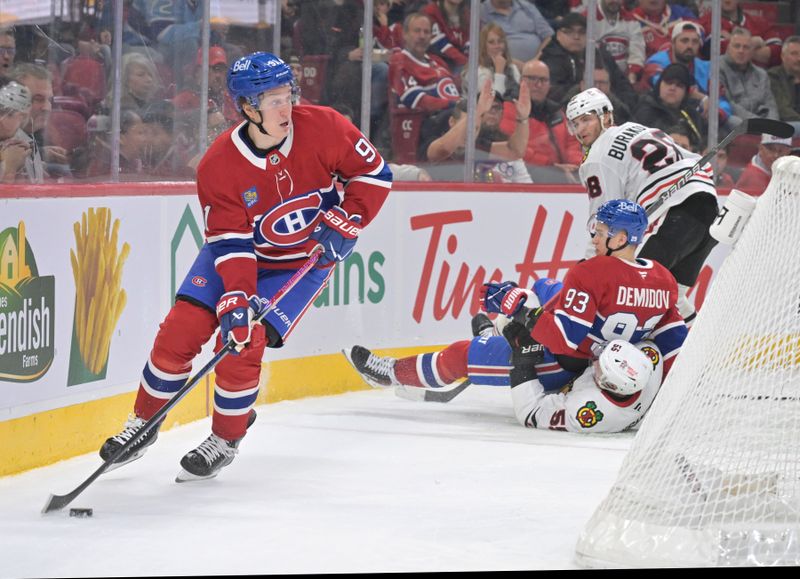 Dec 18, 2025; Montreal, Quebec, CAN; Montreal Canadiens forward Oliver Kapanen (91) plays the puck after teammate forward Ivan Demidov (93) is pulled down by Chicago Blackhawks defenseman Artyom Levshunov (55) during the first period at the Bell Centre. Mandatory Credit: Eric Bolte-Imagn Images