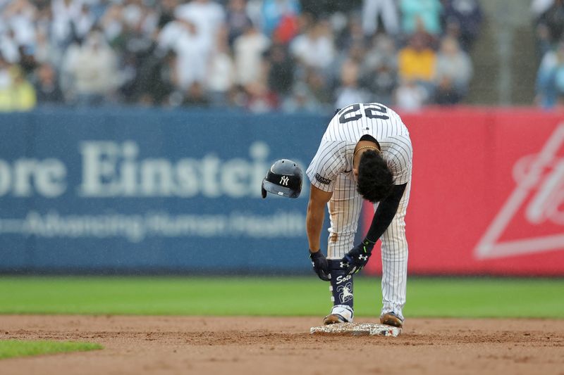 Sep 28, 2024; Bronx, New York, USA; New York Yankees right fielder Juan Soto (22) reacts after being tagged out trying to stretch his RBI single into a double during the seventh inning against the Pittsburgh Pirates at Yankee Stadium. Mandatory Credit: Brad Penner-Imagn Images