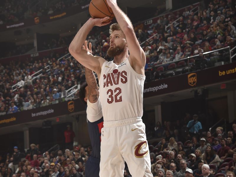 CLEVELAND, OH - DECEMBER 13: Dean Wade #32 of the Cleveland Cavaliers shoots a three point basket during the game against the Washington Wizards on December 13, 2024 at Rocket Mortgage FieldHouse in Cleveland, Ohio. NOTE TO USER: User expressly acknowledges and agrees that, by downloading and/or using this Photograph, user is consenting to the terms and conditions of the Getty Images License Agreement. Mandatory Copyright Notice: Copyright 2024 NBAE (Photo by David Liam Kyle/NBAE via Getty Images)