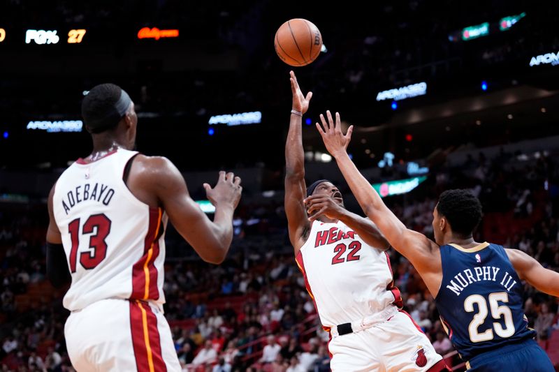 MIAMI, FLORIDA - MARCH 22: Jimmy Butler #22 of the Miami Heat goes up for a shot against Trey Murphy III #25 of the New Orleans Pelicans during the first quarter at Kaseya Center on March 22, 2024 in Miami, Florida. NOTE TO USER: User expressly acknowledges and agrees that, by downloading and or using this photograph, User is consenting to the terms and conditions of the Getty Images License Agreement. (Photo by Rich Storry/Getty Images)