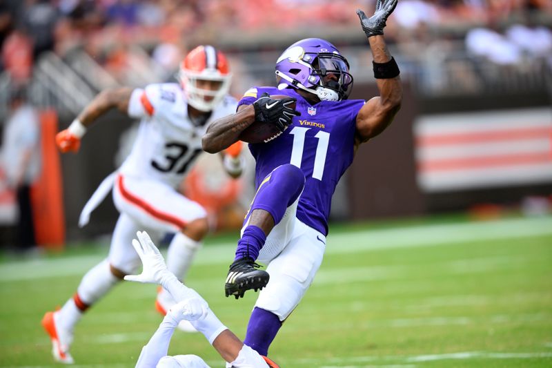 Minnesota Vikings wide receiver Trent Sherfield Sr. (11) pulls in a pass against the Cleveland Browns during the first half of an NFL preseason football game, Saturday, Aug. 17, 2024, in Cleveland. (AP Photo/David Richard)