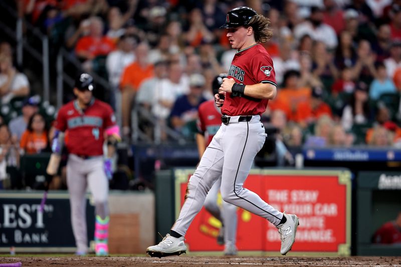 Sep 7, 2024; Houston, Texas, USA; Arizona Diamondbacks center fielder Jake McCarthy (31) crosses home plate to score a run against the Houston Astros during the second inning at Minute Maid Park. Mandatory Credit: Erik Williams-Imagn Images