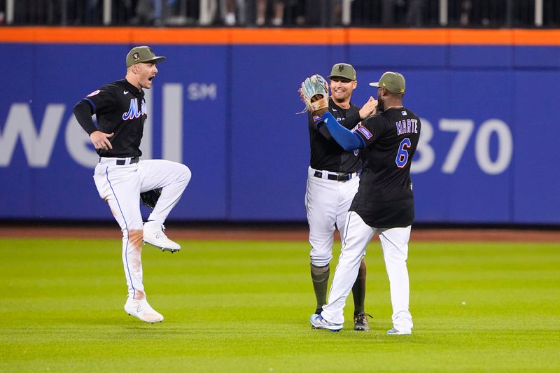 May 21, 2023; New York City, New York, USA; New York Mets right fielder Mark Canha (19) reacts to winning the game against the Cleveland Guardians along with center fielder Brandon Nimmo (9) and right fielder Starling Marte (6) during the ninth inning at Citi Field. Mandatory Credit: Gregory Fisher-USA TODAY Sports