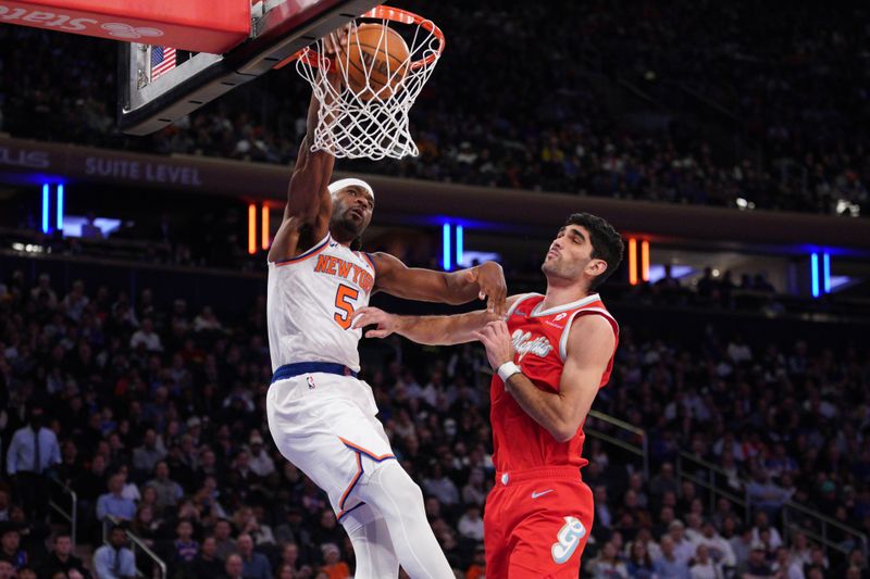 NEW YORK, NEW YORK - JANUARY 27: Precious Achiuwa #5 of the New York Knicks dunks the ball against the Memphis Grizzlies during the second half at Madison Square Garden on January 27, 2025 in New York City. NOTE TO USER: User expressly acknowledges and agrees that, by downloading and or using this photograph, User is consenting to the terms and conditions of the Getty Images License Agreement. (Photo by Evan Bernstein/Getty Images)