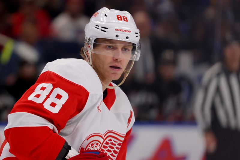 Oct 26, 2024; Buffalo, New York, USA;  Detroit Red Wings right wing Patrick Kane (88) looks for the puck during the second period against the Buffalo Sabres at KeyBank Center. Mandatory Credit: Timothy T. Ludwig-Imagn Images