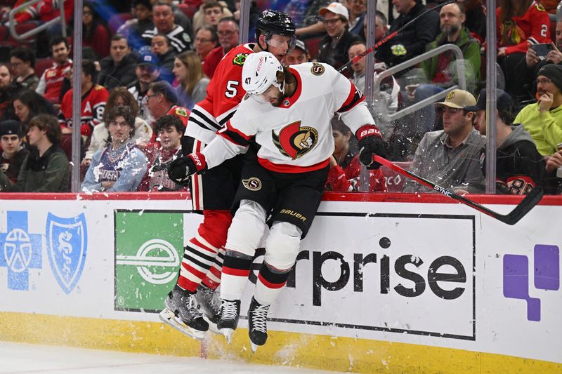 Mar 6, 2023; Chicago, Illinois, USA;  Ottawa Senators forward Mark Kastelic (47) and Chicago Blackhawks defenseman Connor Murphy (5) collide on the wall after chasing after a loose puck in the first period at United Center. Mandatory Credit: Jamie Sabau-USA TODAY Sports