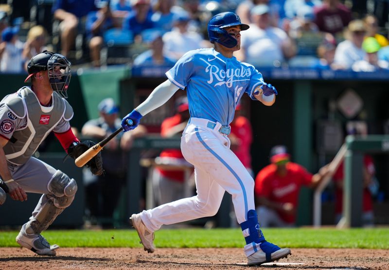 May 28, 2023; Kansas City, Missouri, USA; Kansas City Royals second baseman Michael Massey (19) hits a walk-off single during the ninth inning against the Washington Nationals at Kauffman Stadium. Mandatory Credit: Jay Biggerstaff-USA TODAY Sports