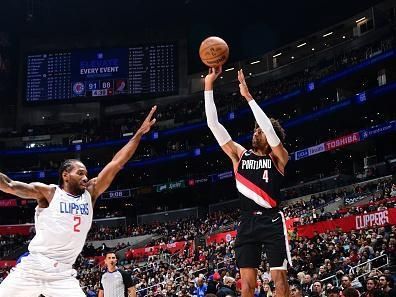 LOS ANGELES, CA - DECEMBER 11: Matisse Thybulle #4 of the Portland Trail Blazers shoots a three point basket against the LA Clippers on December 11, 2023 at Crypto.Com Arena in Los Angeles, California. NOTE TO USER: User expressly acknowledges and agrees that, by downloading and/or using this Photograph, user is consenting to the terms and conditions of the Getty Images License Agreement. Mandatory Copyright Notice: Copyright 2023 NBAE (Photo by Adam Pantozzi/NBAE via Getty Images)