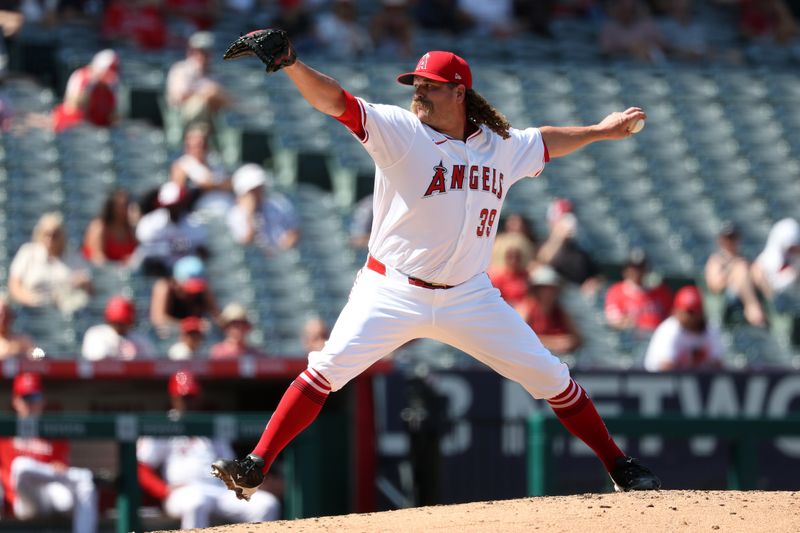 Sep 10, 2025; Anaheim, California, USA; Los Angeles Angels relief pitcher Andrew Chafin (39) pitches during the fifth inning against the Minnesota Twins at Angel Stadium. Mandatory Credit: Kiyoshi Mio-Imagn Images