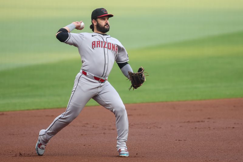 Jun 3, 2025; Atlanta, Georgia, USA; Arizona Diamondbacks third baseman Eugenio Suarez (28) throws a runner out at first against the Atlanta Braves in the first inning at Truist Park. Mandatory Credit: Brett Davis-Imagn Images