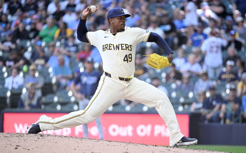 May 1, 2024; Milwaukee, Wisconsin, USA; Milwaukee Brewers relief pitcher Thyago Vieira (49) delivers a pitch against the Tampa Bay Rays in the ninth inning at American Family Field. Mandatory Credit: Michael McLoone-USA TODAY Sports