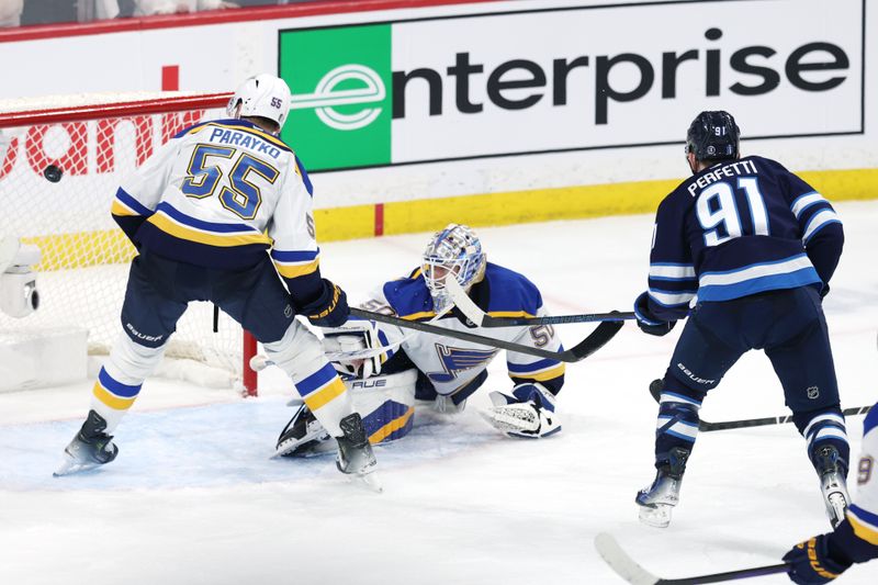 May 4, 2025; Winnipeg, Manitoba, CAN; Winnipeg Jets center Cole Perfetti (91) scores on St. Louis Blues goaltender Jordan Binnington (50) in the third period in game seven of the first round of the 2025 Stanley Cup Playoffs at Canada Life Centre. Mandatory Credit: James Carey Lauder-Imagn Images