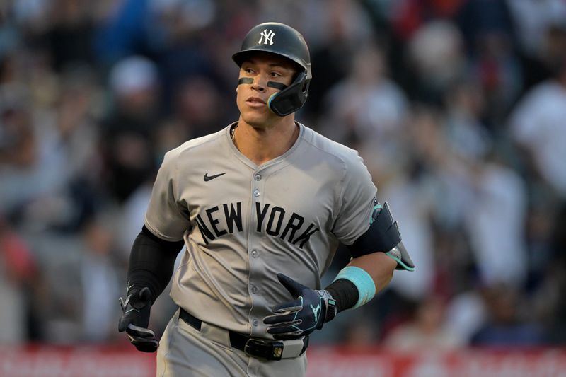 May 30, 2024; Anaheim, California, USA;  New York Yankees center fielder Aaron Judge (99) rounds the bases on a two-run home run scoring right fielder Juan Soto (22) in the fourth inning against the Los Angeles Angels at Angel Stadium. Mandatory Credit: Jayne Kamin-Oncea-USA TODAY Sports
