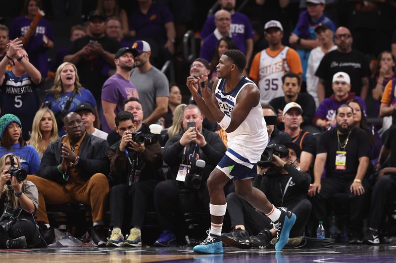 PHOENIX, ARIZONA - APRIL 28: Anthony Edwards #5 of the Minnesota Timberwolves reacts after scoring against the Phoenix Suns during the second half of game four of the Western Conference First Round Playoffs at Footprint Center on April 28, 2024 in Phoenix, Arizona. The Timberwolves defeated the Suns 122-116 and win the series 4-0. NOTE TO USER: User expressly acknowledges and agrees that, by downloading and or using this photograph, User is consenting to the terms and conditions of the Getty Images License Agreement.  (Photo by Christian Petersen/Getty Images)