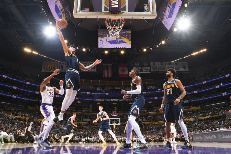 LOS ANGELES, CA - NOVEMBER 23: Michael Porter Jr. #1 of the Denver Nuggets drives to the basket during the game against the Los Angeles Lakers on November 23, 2024 at Crypto.Com Arena in Los Angeles, California. NOTE TO USER: User expressly acknowledges and agrees that, by downloading and/or using this Photograph, user is consenting to the terms and conditions of the Getty Images License Agreement. Mandatory Copyright Notice: Copyright 2024 NBAE (Photo by Adam Pantozzi/NBAE via Getty Images)