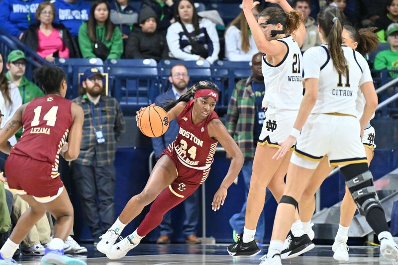 Jan 11, 2024; South Bend, Indiana, USA; Boston College Eagles guard Dontavia Waggoner (24) dribbles as Notre Dame Fighting Irish forward Maddy Westbeld (21) defends in the second half at the Purcell Pavilion. Mandatory Credit: Matt Cashore-USA TODAY Sports