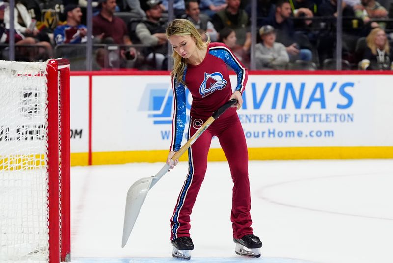 Apr 8, 2025; Denver, Colorado, USA; Colorado Avalanche ice patrol Sydney Browne clears the crease during a overtime period against the Vegas Golden Knights at Ball Arena. Mandatory Credit: Ron Chenoy-Imagn Images