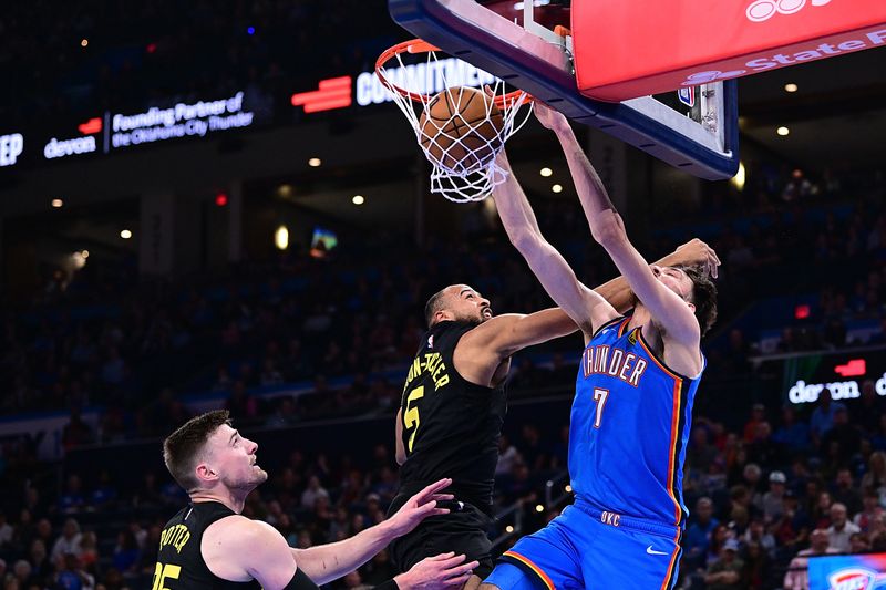 OKLAHOMA CITY, OKLAHOMA - MARCH 20: Chet Holmgren #7 of the Oklahoma City Thunder finishes a dunk against Talen Horton-Tucker #5 of the Utah Jazz during the second half at Paycom Center on March 20, 2024 in Oklahoma City, Oklahoma. NOTE TO USER: User expressly acknowledges and agrees that, by downloading and or using this Photograph, user is consenting to the terms and conditions of the Getty Images License Agreement. (Photo by Joshua Gateley/Getty Images)