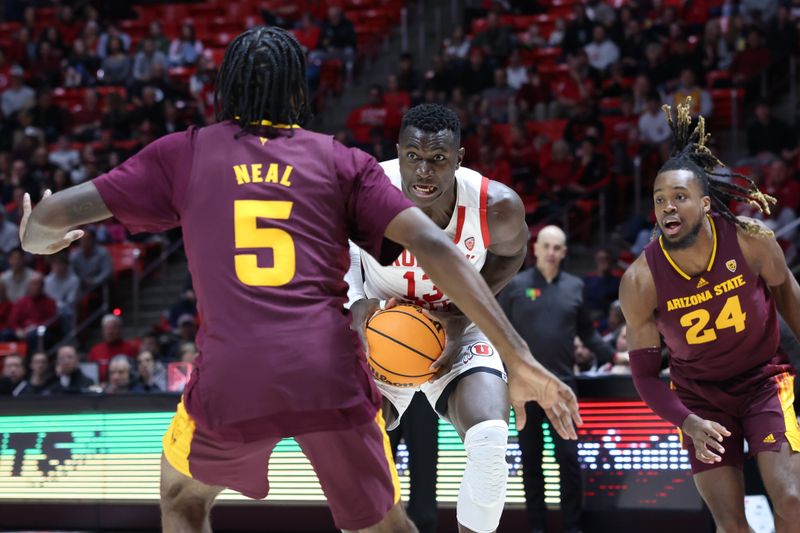 Feb 10, 2024; Salt Lake City, Utah, USA; Utah Utes center Keba Keita (13) goes to the basket against Arizona State Sun Devils guard Jamiya Neal (5) and forward Bryant Selebangue (24) during the second half at Jon M. Huntsman Center. Mandatory Credit: Rob Gray-USA TODAY Sports