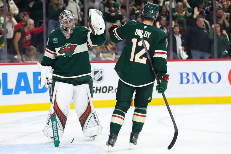 Oct 10, 2024; Saint Paul, Minnesota, USA; Minnesota Wild left wing Matt Boldy (12) celebrates his goal with goaltender Filip Gustavsson (32) during the first period against the Columbus Blue Jackets at Xcel Energy Center. Mandatory Credit: Matt Krohn-Imagn Images