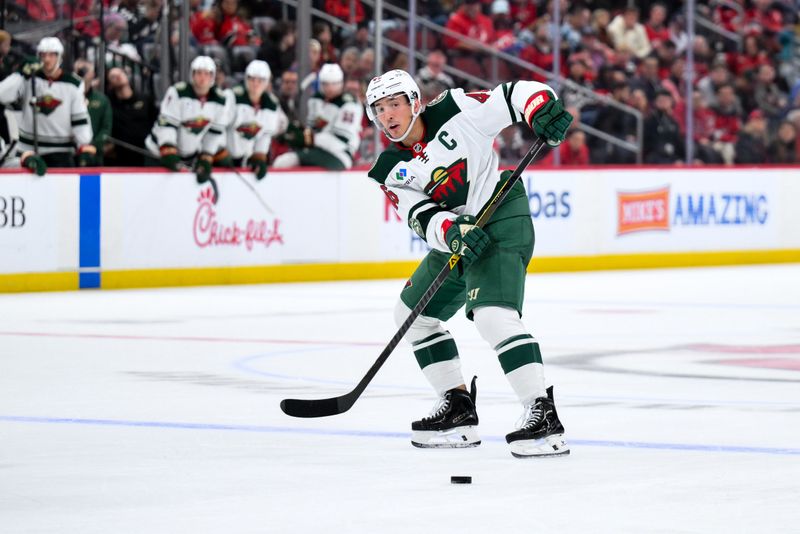 Oct 22, 2025; Newark, New Jersey, USA; Minnesota Wild defenseman Jared Spurgeon (46) passes the puck against the New Jersey Devils during the third period at Prudential Center. Mandatory Credit: John Jones-Imagn Images