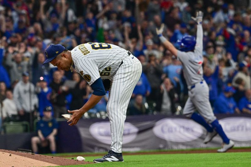 May 3, 2025; Milwaukee, Wisconsin, USA;  Milwaukee Brewers starting pitcher Jose Quintana (62) rubs a new ball after giving up a home run to Chicago Cubs shortstop Dansby Swanson (7) in the fourth inning at American Family Field. Mandatory Credit: Benny Sieu-Imagn Images