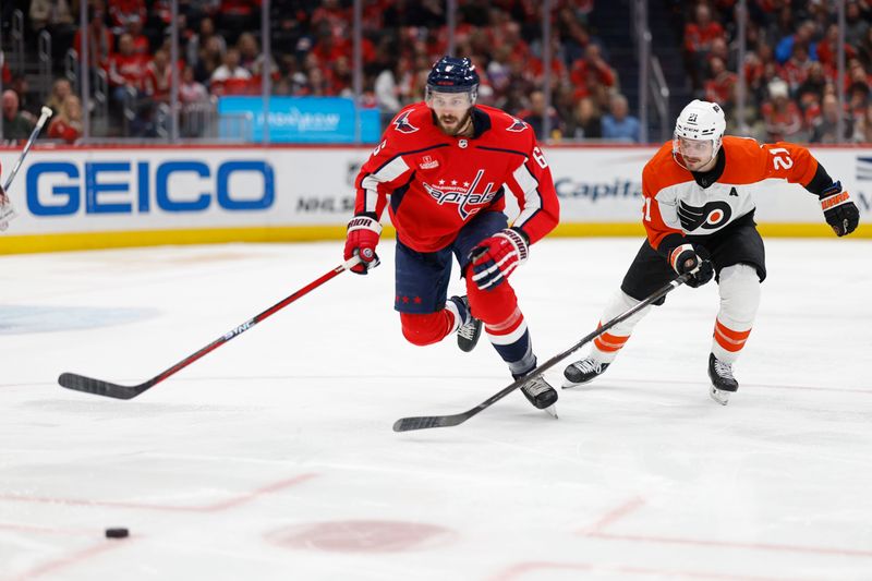 Mar 1, 2024; Washington, District of Columbia, USA; Washington Capitals defenseman Joel Edmundson (6) and Philadelphia Flyers center Scott Laughton (21) chase the puck in the second period at Capital One Arena. Mandatory Credit: Geoff Burke-USA TODAY Sports