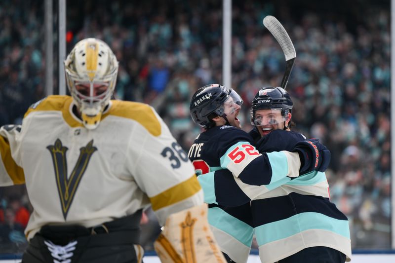 Jan 1, 2024; Seattle, Washington, USA; Seattle Kraken left wing Tye Kartye (52) and defenseman Will Borgen (3) celebrate after Borgen scored a goal against the Vegas Golden Knights during the second period in the 2024 Winter Classic ice hockey game at T-Mobile Park. Mandatory Credit: Steven Bisig-USA TODAY Sports