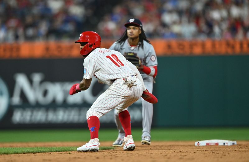 Aug 17, 2024; Philadelphia, Pennsylvania, USA; Philadelphia Phillies outfielder Johan Rojas (18) steals second base against the Washington Nationals in the sixth inning at Citizens Bank Park. Mandatory Credit: Kyle Ross-USA TODAY Sports