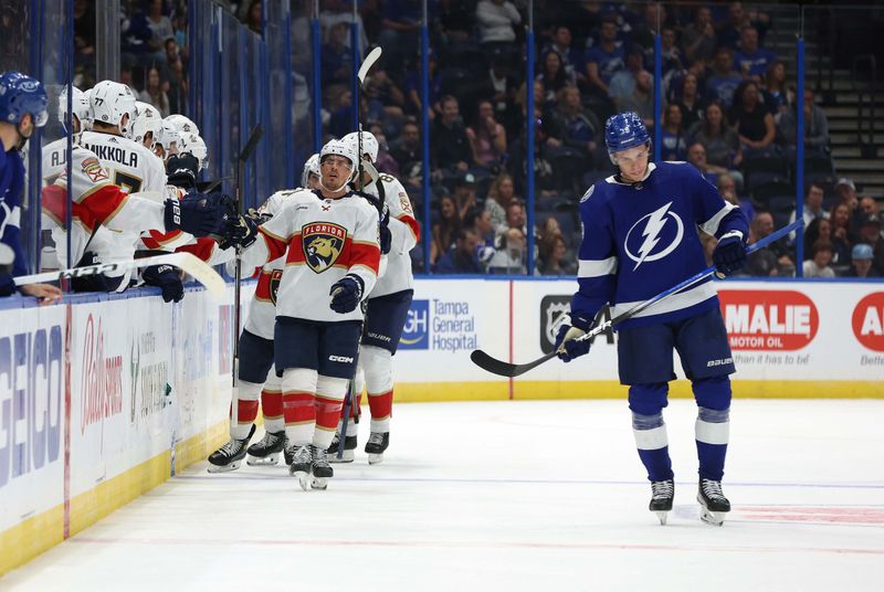 Oct 5, 2023; Tampa, Florida, USA; Florida Panthers center Nick Cousins (21) is congratulated after he scored a goal against the Tampa Bay Lightning during the second period at Amalie Arena. Mandatory Credit: Kim Klement Neitzel-USA TODAY Sports