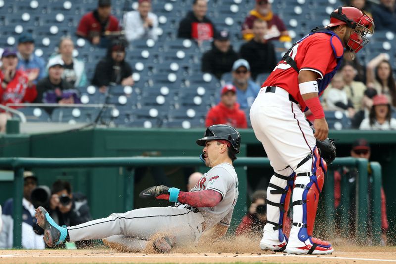 Apr 6, 2025; Washington, District of Columbia, USA; Arizona Diamondbacks outfielder Corbin Carroll (7) scores a run during the first inning against the Washington Nationals at Nationals Park. Mandatory Credit: Daniel Kucin Jr.-Imagn Images
