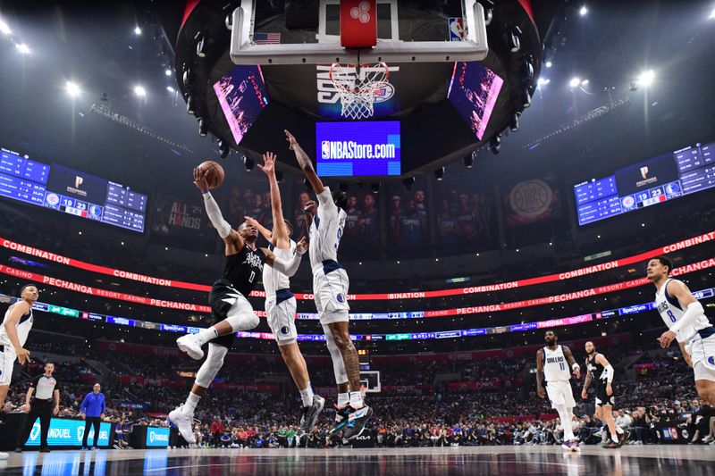 LOS ANGELES, CA - APRIL 23: Russell Westbrook #0 of the LA Clippers goes to the basket during the game against the Dallas Mavericks during Round 1 Game 2 of the 2024 NBA Playoffs on April 23, 2024 at Crypto.Com Arena in Los Angeles, California. NOTE TO USER: User expressly acknowledges and agrees that, by downloading and/or using this Photograph, user is consenting to the terms and conditions of the Getty Images License Agreement. Mandatory Copyright Notice: Copyright 2024 NBAE (Photo by Adam Pantozzi/NBAE via Getty Images)