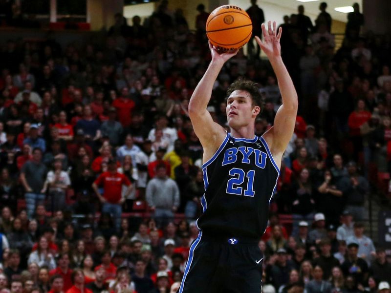 Jan 20, 2024; Lubbock, Texas, USA;  Brigham Young Cougars guard Trevin Knell (21) shoots against Texas Tech Red Raiders center Warren Washington (22) in the first half at United Supermarkets Arena. Mandatory Credit: Michael C. Johnson-USA TODAY Sports