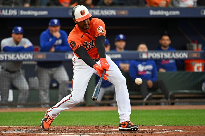 Oct 8, 2023; Baltimore, Maryland, USA; Baltimore Orioles center fielder Aaron Hicks (34) hits a two run RBI during the first inning against the Texas Rangers during game two of the ALDS for the 2023 MLB playoffs at Oriole Park at Camden Yards. Mandatory Credit: Tommy Gilligan-USA TODAY Sports