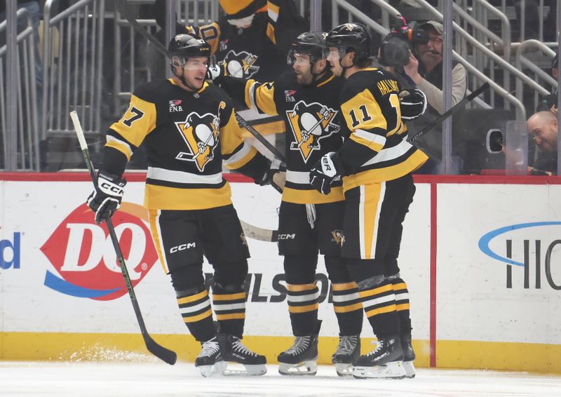 Oct 27, 2025; Pittsburgh, Pennsylvania, USA;  Pittsburgh Penguins center Sidney Crosby (87) and center Filip Hallander (11) congratulate right wing Bryan Rust (middle) on his goal against the St. Louis Blues during the first period at PPG Paints Arena. Mandatory Credit: Charles LeClaire-Imagn Images