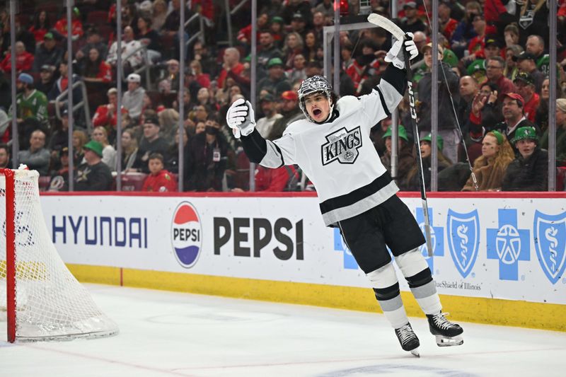 Mar 15, 2024; Chicago, Illinois, USA; Los Angeles Kings forward Alex Turcotte (38) celebrates after teammate forward Alex Laferriere (78) scores a goal in the first period against the Chicago Blackhawks at United Center. Mandatory Credit: Jamie Sabau-USA TODAY Sports