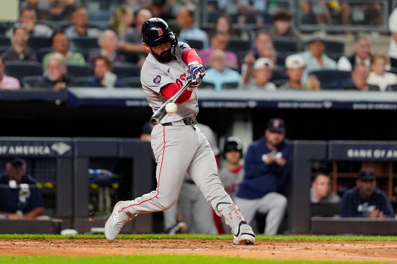 Sep 12, 2024; Bronx, New York, USA; Boston Red Sox first baseman Connor Wong (12) hits a double against the New York Yankees during the second inning at Yankee Stadium. Mandatory Credit: Gregory Fisher-Imagn Images