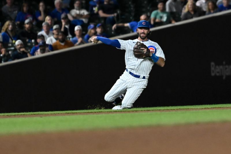 Sep 20, 2023; Chicago, Illinois, USA; Chicago Cubs shortstop Dansby Swanson (7) throws to second base during the ninth inning against the Pittsburgh Pirates at Wrigley Field. Mandatory Credit: Matt Marton-USA TODAY Sports