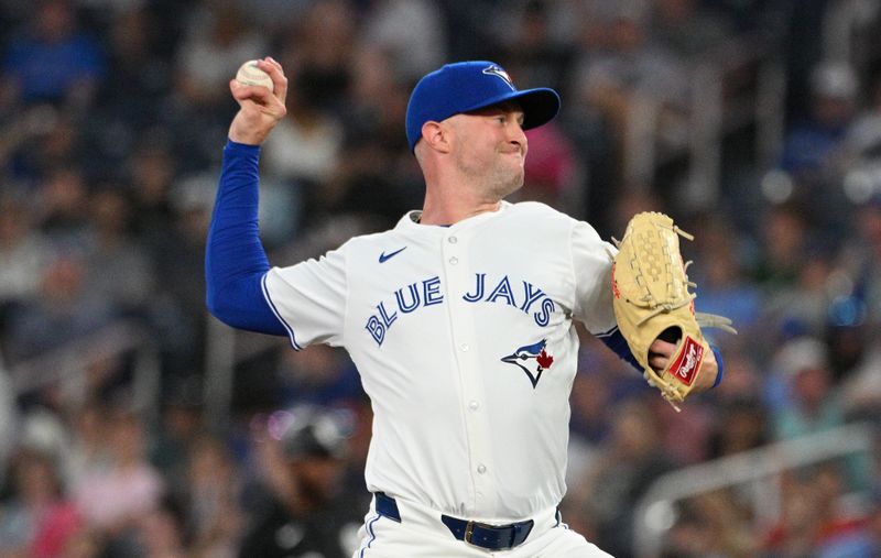 May 21, 2024; Toronto, Ontario, CAN;  Toronto Blue Jays relief pitcher Trent Richards (33) delivers a pitch against the Chicago White Sox in the eighth inning at Rogers Centre. Mandatory Credit: Dan Hamilton-USA TODAY Sports