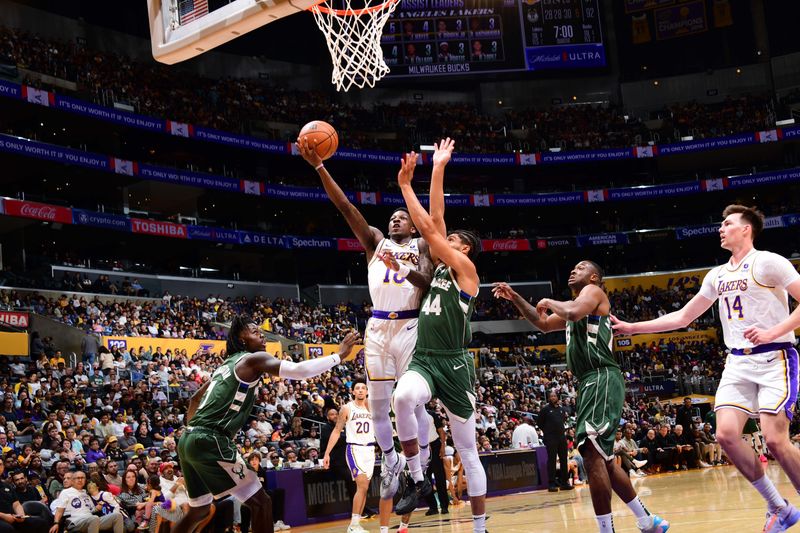 LOS ANGELES, CA - OCTOBER 15: Damion Baugh #18 of the Los Angeles Lakers  drives to the basket during the game against the Milwaukee Bucks on October 15, 2023 at Crypto.Com Arena in Los Angeles, California. NOTE TO USER: User expressly acknowledges and agrees that, by downloading and/or using this Photograph, user is consenting to the terms and conditions of the Getty Images License Agreement. Mandatory Copyright Notice: Copyright 2023 NBAE (Photo by Adam Pantozzi/NBAE via Getty Images)