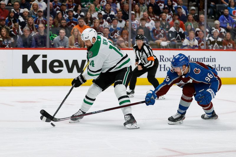 May 11, 2024; Denver, Colorado, USA; Dallas Stars left wing Jamie Benn (14) controls the puck ahead of Colorado Avalanche right wing Mikko Rantanen (96) in the first period in game three of the second round of the 2024 Stanley Cup Playoffs at Ball Arena. Mandatory Credit: Isaiah J. Downing-USA TODAY Sports