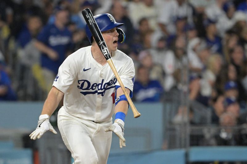 Sep 26, 2024; Los Angeles, California, USA;  Los Angeles Dodgers catcher Will Smith (16) celebrates after hitting a two-run home run off San Diego Padres starting pitcher Joe Musgrove (44) in the seventh inning at Dodger Stadium. Mandatory Credit: Jayne Kamin-Oncea-Imagn Images