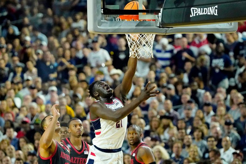 Apr 3, 2023; Houston, TX, USA; Connecticut Huskies forward Adama Sanogo (21) shoots the ball against the San Diego State Aztecs during the first half in the national championship game of the 2023 NCAA Tournament at NRG Stadium. Mandatory Credit: Bob Donnan-USA TODAY Sports