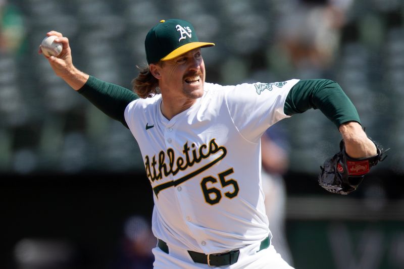 Aug 22, 2024; Oakland, California, USA; Oakland Athletics pitcher Tyler Ferguson (65) delivers a pitch against the Tampa Bay Rays during the eighth inning at Oakland-Alameda County Coliseum. Mandatory Credit: D. Ross Cameron-USA TODAY Sports