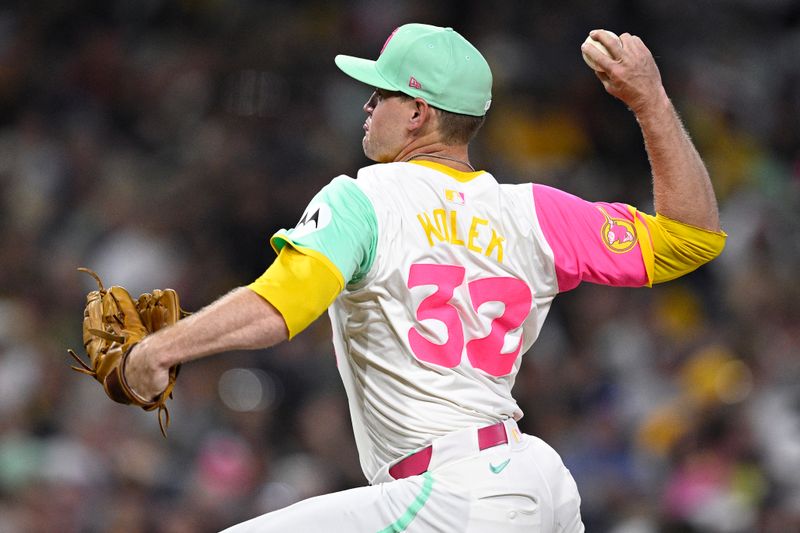 Jun 21, 2024; San Diego, California, USA; San Diego Padres relief pitcher Stephen Kolek (32) pitches against the Milwaukee Brewers during the eighth inning at Petco Park. Mandatory Credit: Orlando Ramirez-USA TODAY Sports