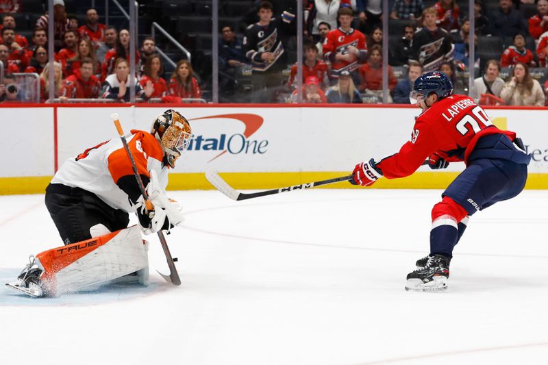 Oct 23, 2024; Washington, District of Columbia, USA; Philadelphia Flyers goaltender Ivan Fedotov (82) makes a save on Washington Capitals center Hendrix Lapierre (29) in the third period at Capital One Arena. Mandatory Credit: Geoff Burke-Imagn Images