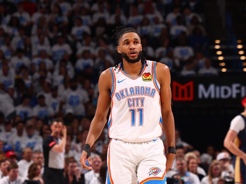 OKLAHOMA CITY, OK - APRIL 21:  Isaiah Joe #11 of the Oklahoma City Thunder looks on during the game against the New Orleans Pelicans  during Round 1 Game 1 of the 2024 NBA Playoffs on April 21, 2024 at Paycom Arena in Oklahoma City, Oklahoma. NOTE TO USER: User expressly acknowledges and agrees that, by downloading and or using this photograph, User is consenting to the terms and conditions of the Getty Images License Agreement. Mandatory Copyright Notice: Copyright 2024 NBAE (Photo by Zach Beeker/NBAE via Getty Images)