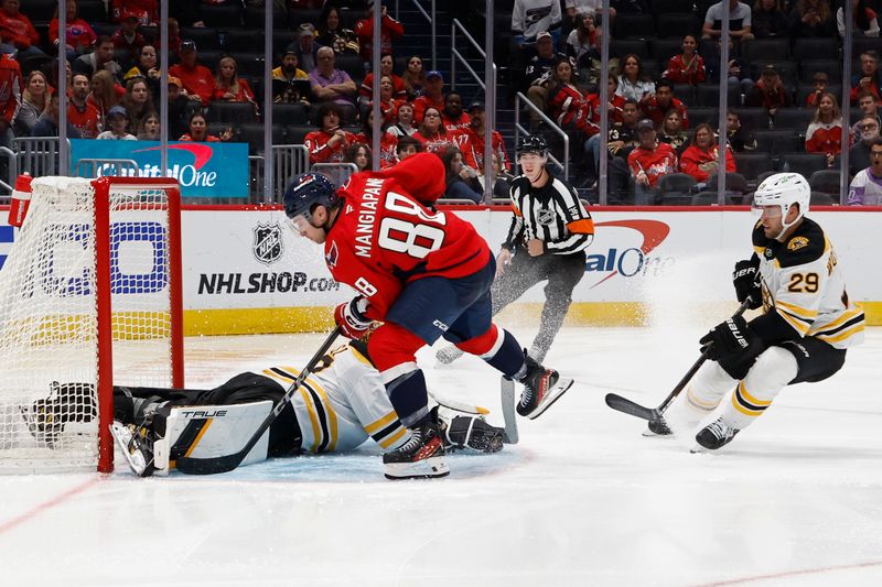 Oct 5, 2024; Washington, District of Columbia, USA; Boston Bruins goaltender Brandon Bussi (30) makes a save on Washington Capitals left wing Andrew Mangiapane (88) in the third period at Capital One Arena. Mandatory Credit: Geoff Burke-Imagn Images