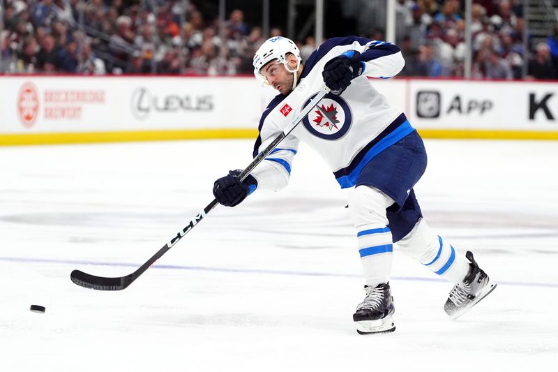 Apr 28, 2024; Denver, Colorado, USA; Winnipeg Jets defenseman Dylan DeMelo (2) shoots the puck during the third period against the Colorado Avalanche in game four of the first round of the 2024 Stanley Cup Playoffs at Ball Arena. Mandatory Credit: Ron Chenoy-USA TODAY Sports